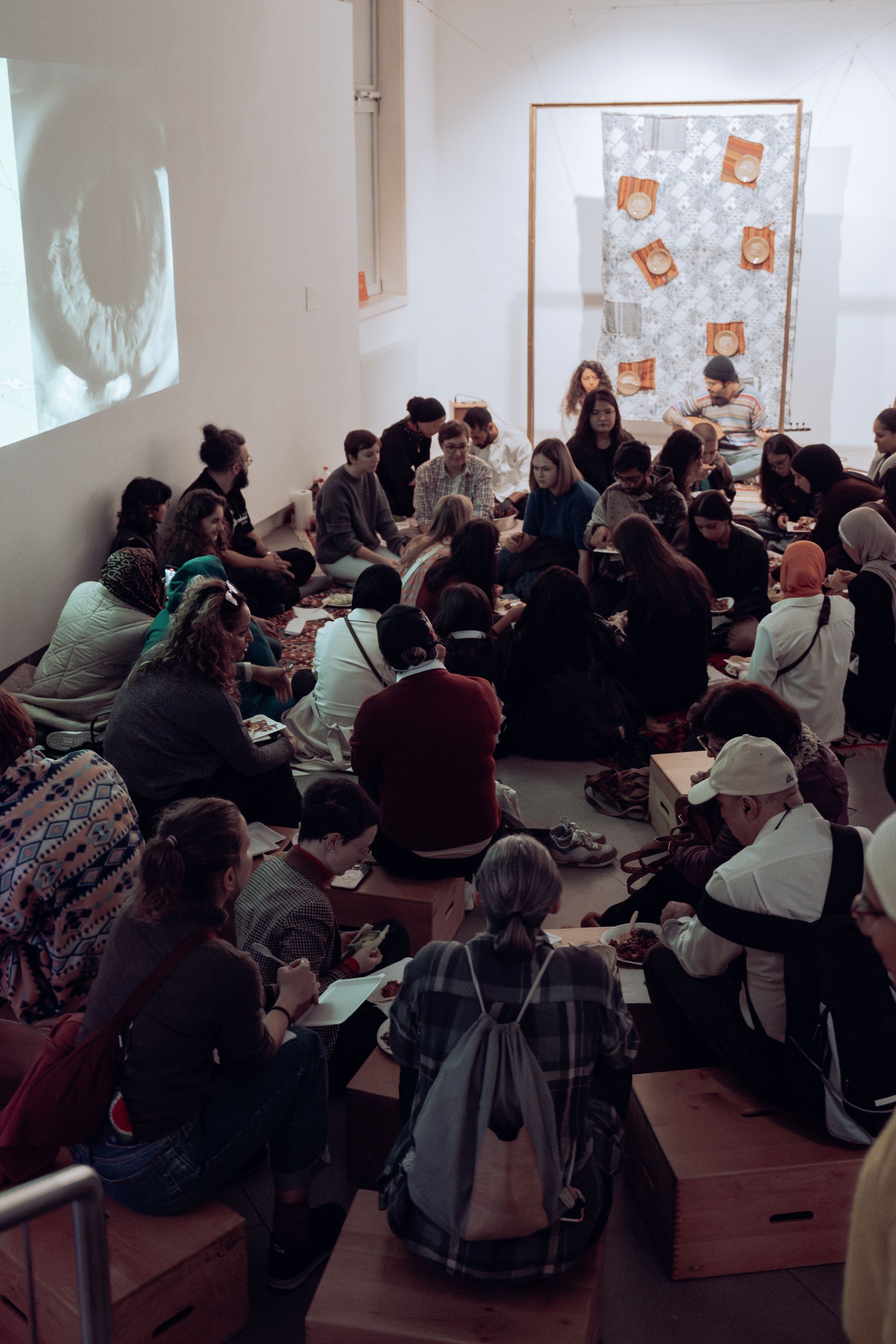 Eşim Karakuyu und Khashajar Hani, Interactive Performance with food, Exhibit Eschenbachgasse, as part of Muslim*Contemporary exhibition, on 26 October 2024. Photo by Suna Films