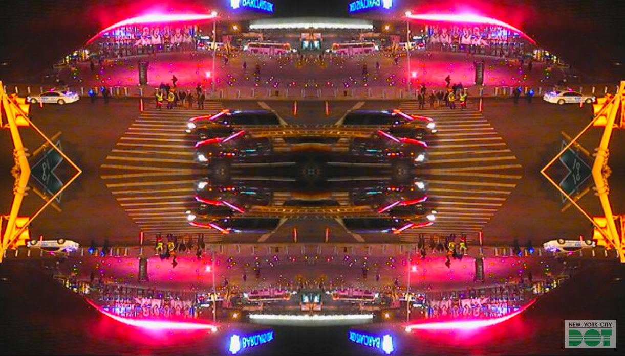 Very colorful photo with cars, lights and billboards reflecting each other.