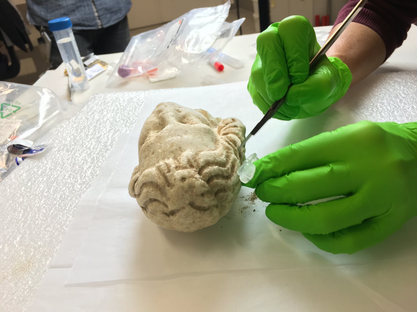 Removal of dirt and dust from antique marble head for molecular biological analyses, photo © Sterflinger