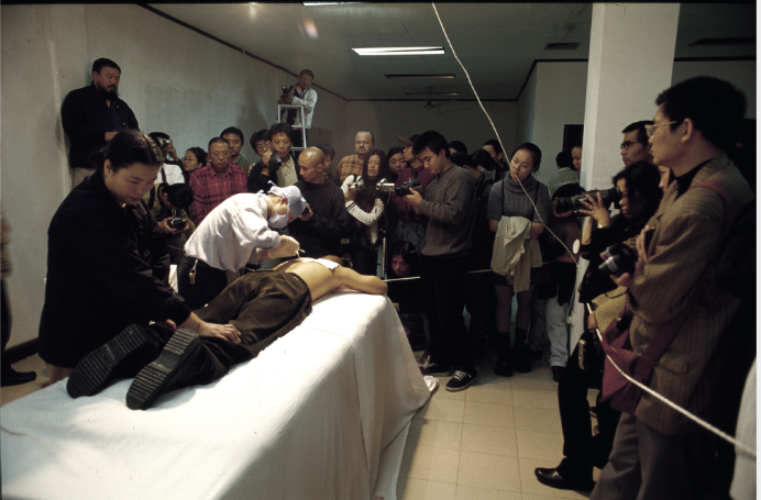 Planting Grasses (2000), performance at the Fuck Off exhibition, Shanghai.